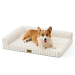 Front view of a dog resting on the Cozy Kiss Striped Faux L-Shaped Washable Dog Bed, showing the raised bolster design. 