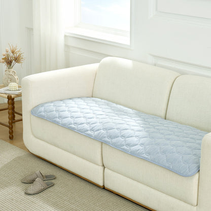 Blue couch cover on a white sofa in a living room setting.#Color_Sky Blue