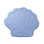 Blue shell-shaped bath mat on a white background