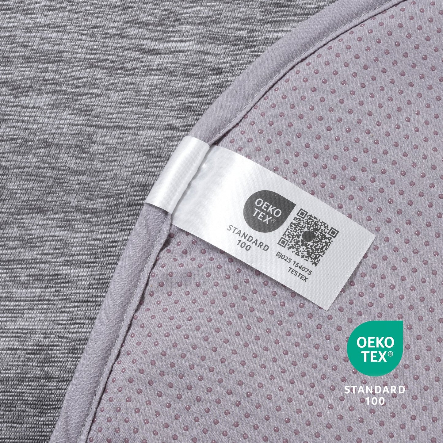 Oeko-Tex label on gray paw-shaped cooling pet mat fabric.#color_Dark Grey