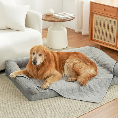 Cozy Kiss pet cooling blanket front view with a dog sitting on it. #color_Grey