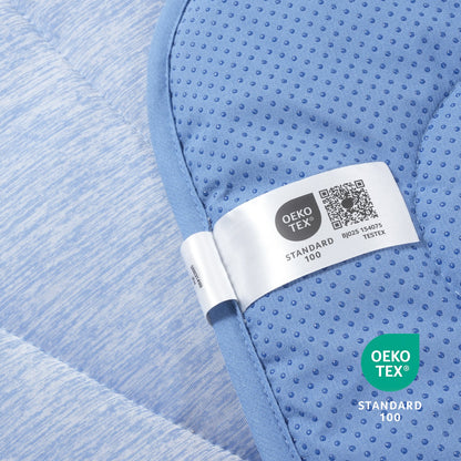 Close-up of a blue textured fabric with an Oeko-Tex label.#color_Blue