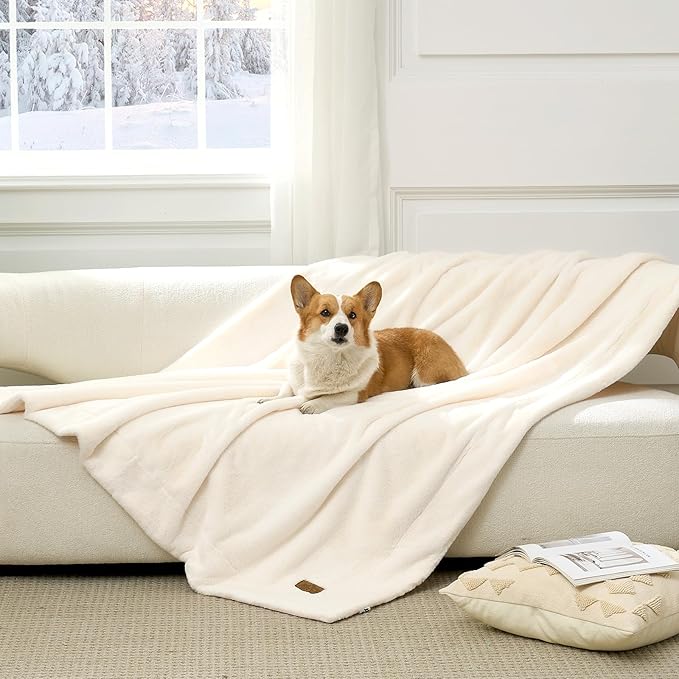 Cozy Kiss Leakproof Faux Fur Pet Blanket in Cream White front view with a dog sitting on it. #color_Cream White