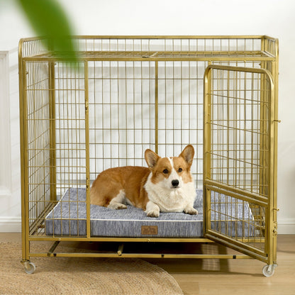 Dog lying on a cooling cushion inside a gold metal dog crate.#color_Dark Grey