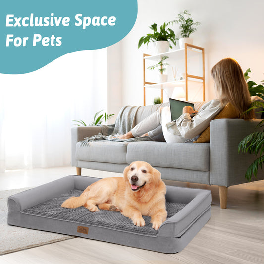 Dog relaxing on a Cozy Kiss grey orthopedic dog bed beside its owner on the sofa, an exclusive space for pets#color_Grey