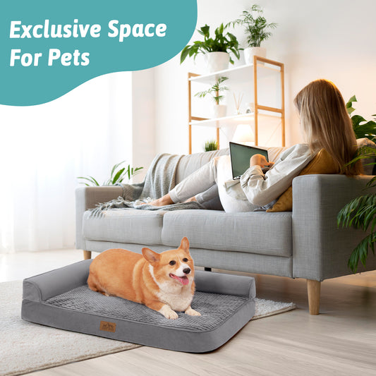 Dog relaxing on a Cozy Kiss grey orthopedic dog bed beside its owner on the sofa, an exclusive space for pets#color_Grey